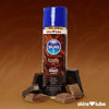 A brown gradient background with a Skins Double Chocolate Lube stood in the middle surrounded by pieces of chocolate