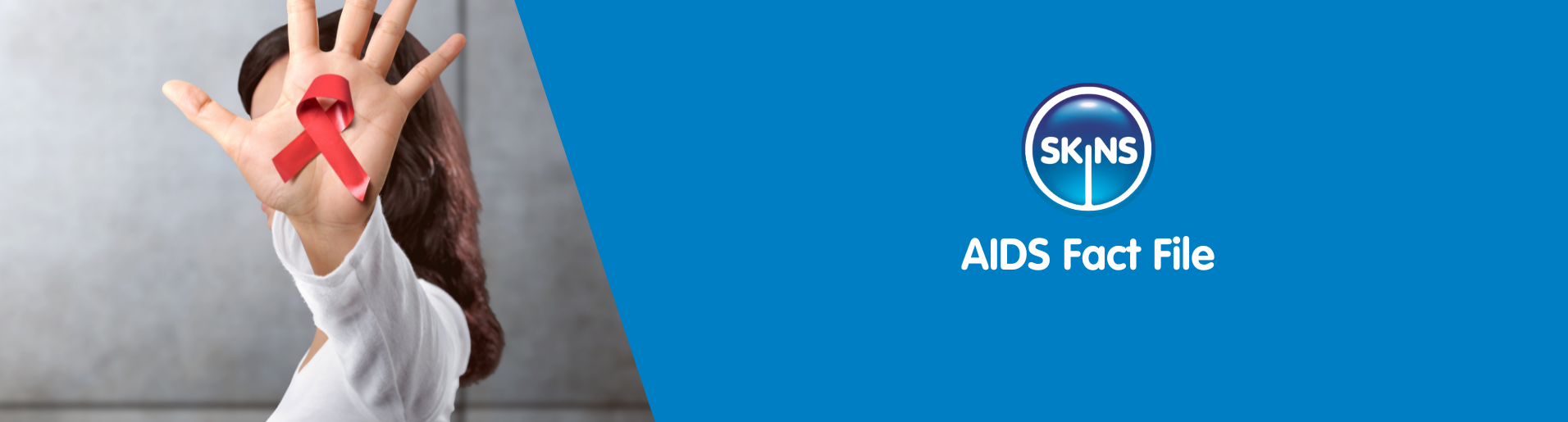 Woman displaying AIDS ribbon in her hand