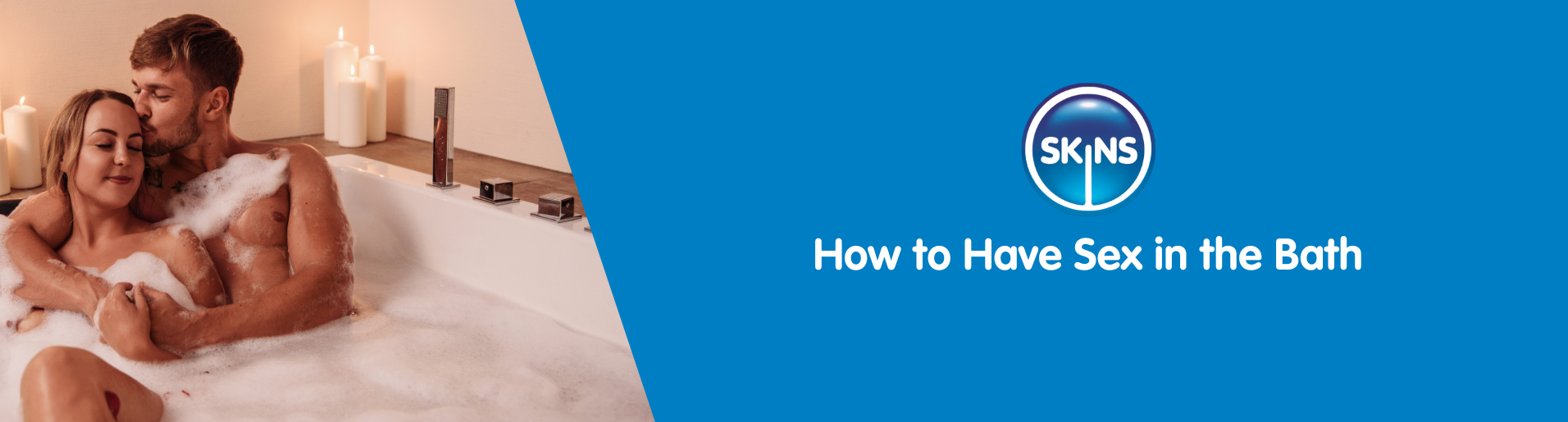 A male and female couple embracing one another in a candle lit bath