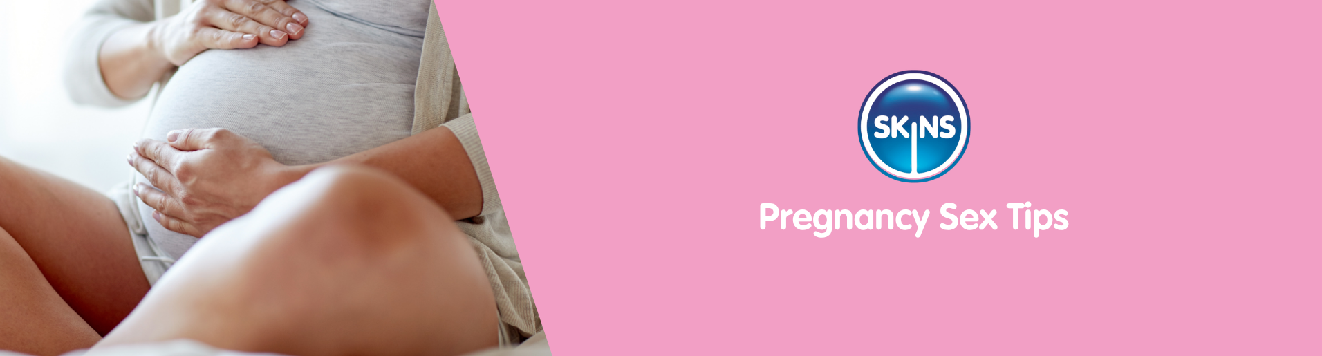 pregnant woman holding her belly while sat down