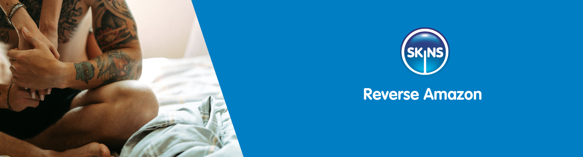 Woman hugging her man from behind while sat in bed