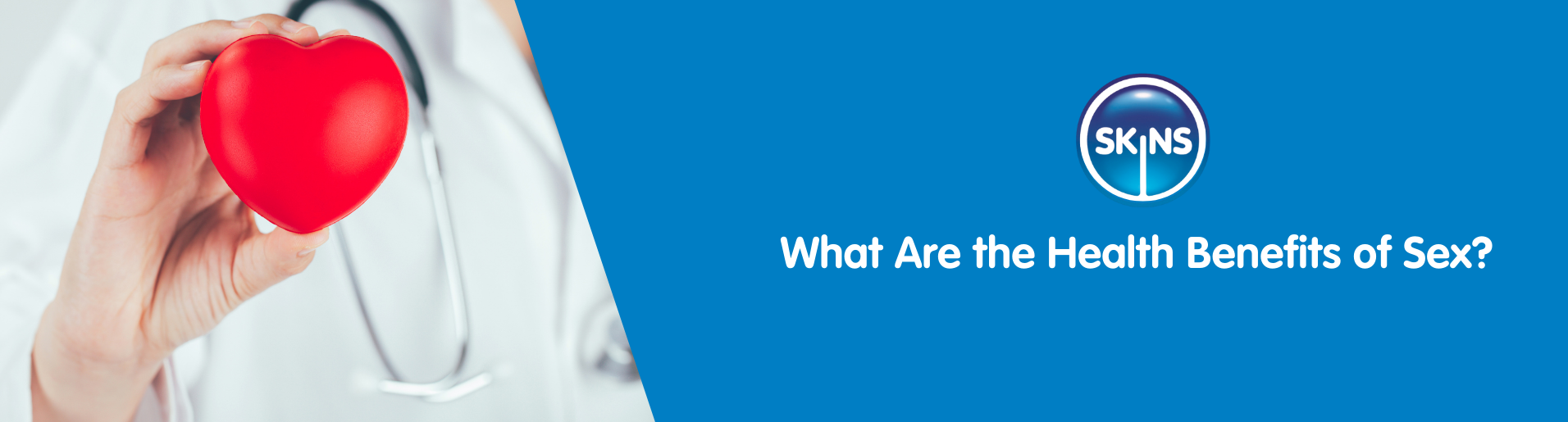 A medical professional wearing a stethoscope holding up a heart toy