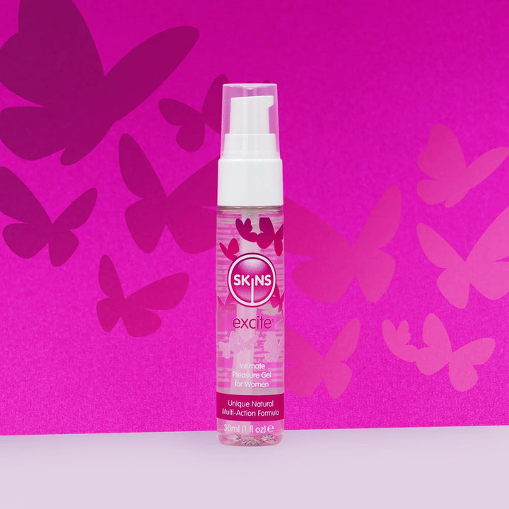 Skins excite product bottle on a pink background with butterfly silhouettes