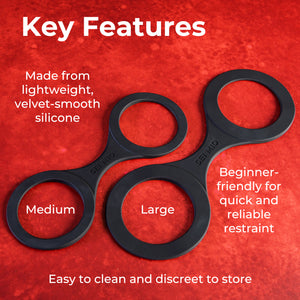 Black silicone restraint device with text on a red background