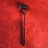 Gun metal pinwheel on a red textured background