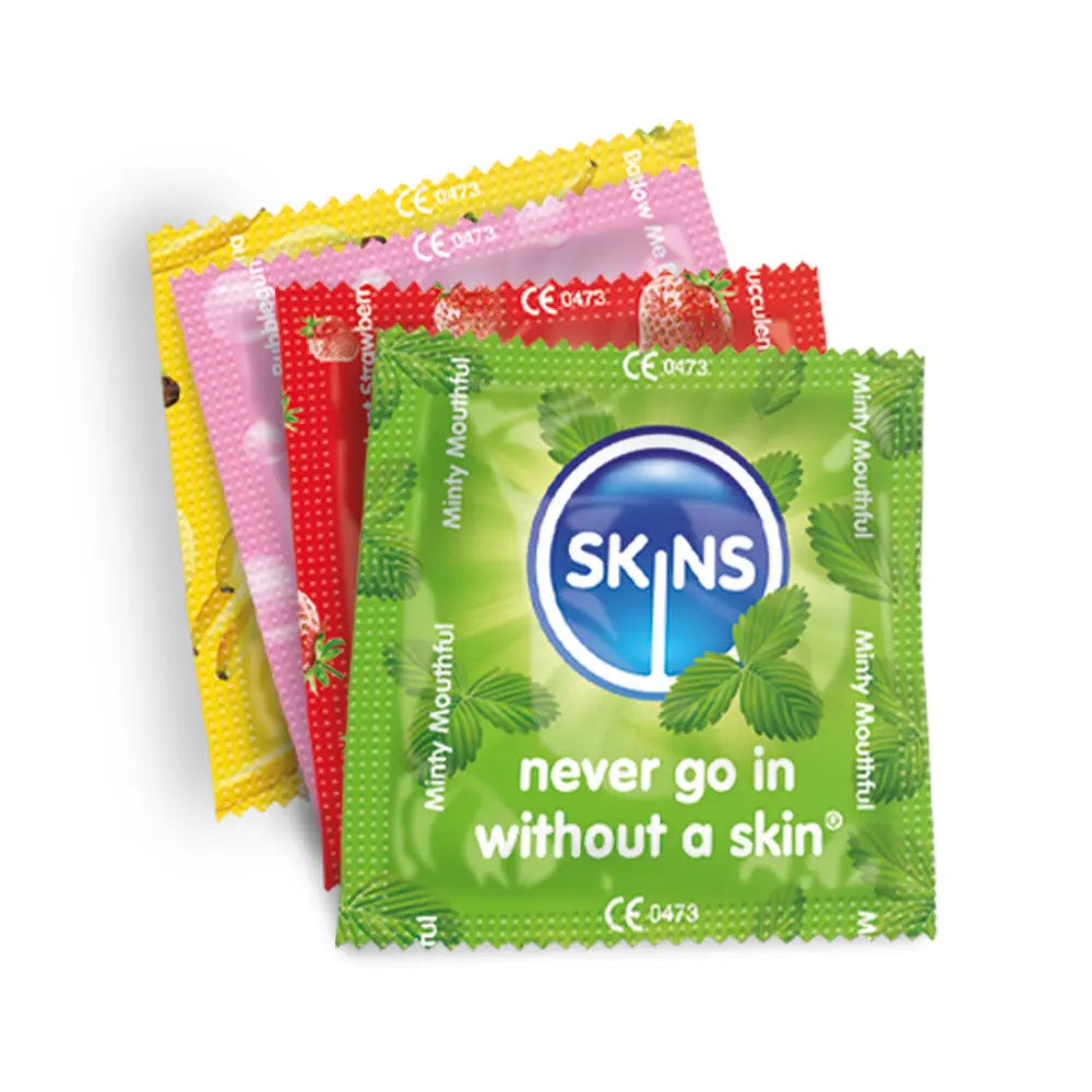 Four colorful packets of Skins minty mouthwash with a green packet in front.