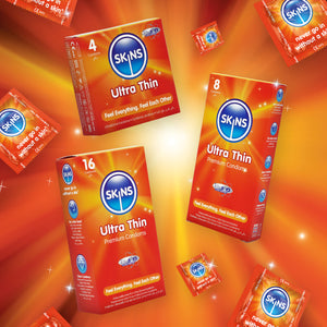 SKINS Ultra Thin condoms packaging on an orange background