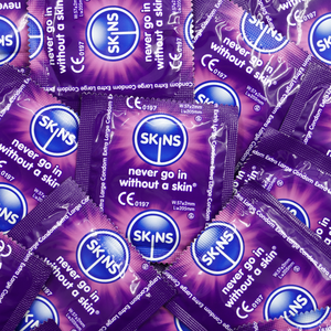 Multiple Skins brand condoms with purple and blue packaging.