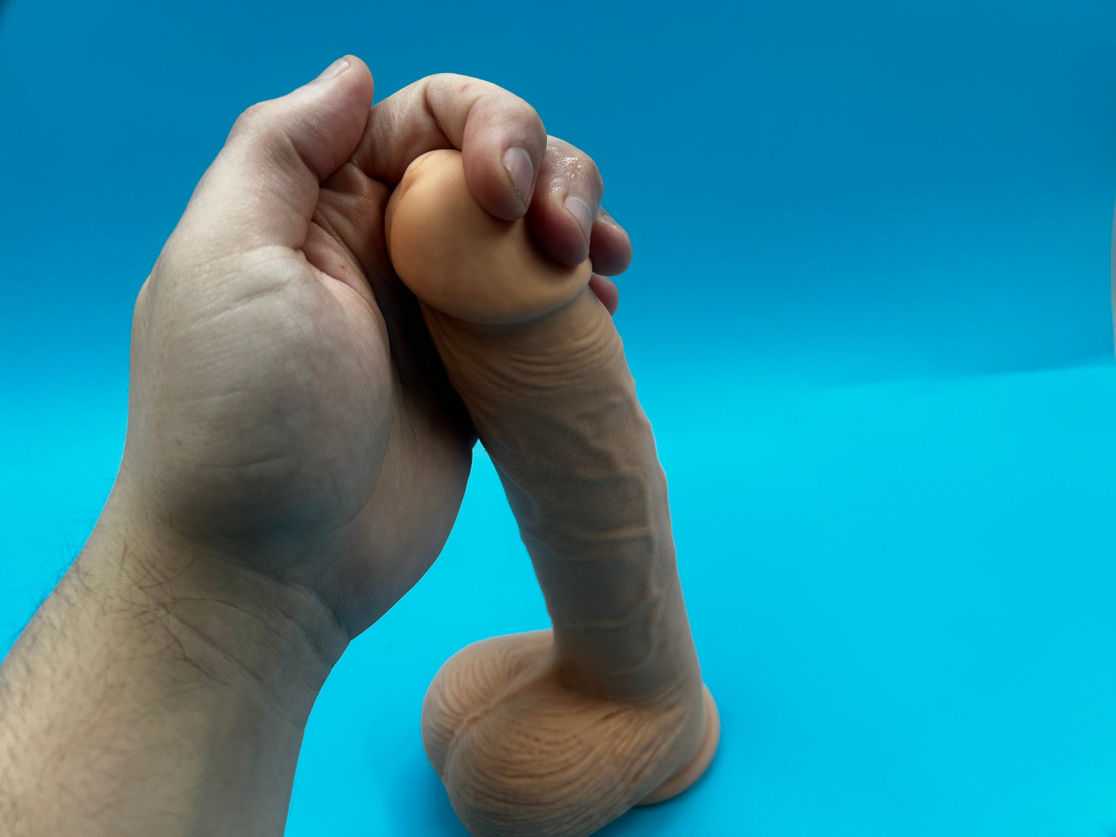 massaging delay spray onto the head of the penis