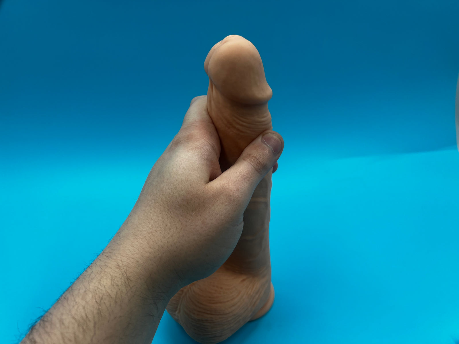 massaging the formula into the shaft of the penis