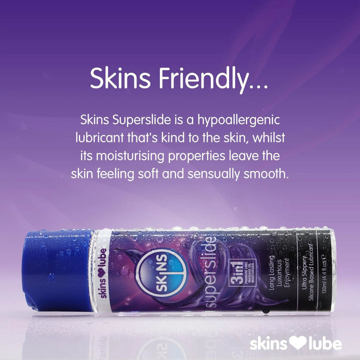 A purple gradient background with a Skins Superslide lube laid horizontally at the bottom of the image. The lube bottle is covered in water droplets and above this is a paragraph of text explaining why the Skins Superslide lube is skin freindly