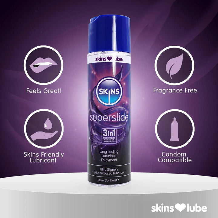 Dark purple background with the Skins Superslide lube bottle in the middle, stood on a white podium. On the left of the bottle are 2 circular icons and on the right are 2 circular icons. In the bottom right-hand corner a Skins love lube logo.